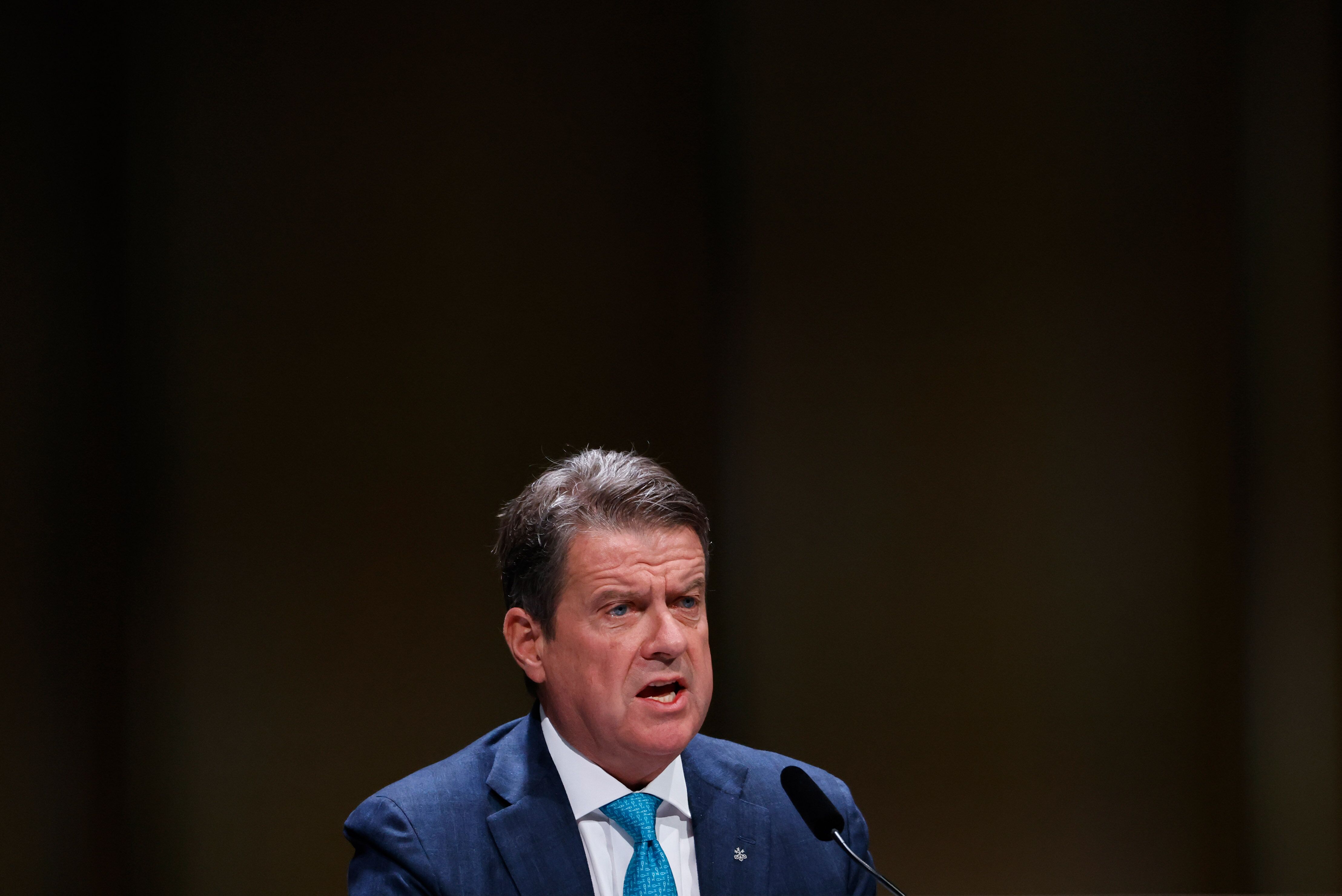 Colm Kelleher, chairman of UBS Group AG, speaks at the company's annual general meeting of shareholders in Basel, Switzerland, on Wednesday, April 5, 2023. UBS's reported plan to lay off as many as 36,000 workers would make it the company with the largest job cuts globally in the past six months. Photographer: Stefan Wermuth/Bloomberg