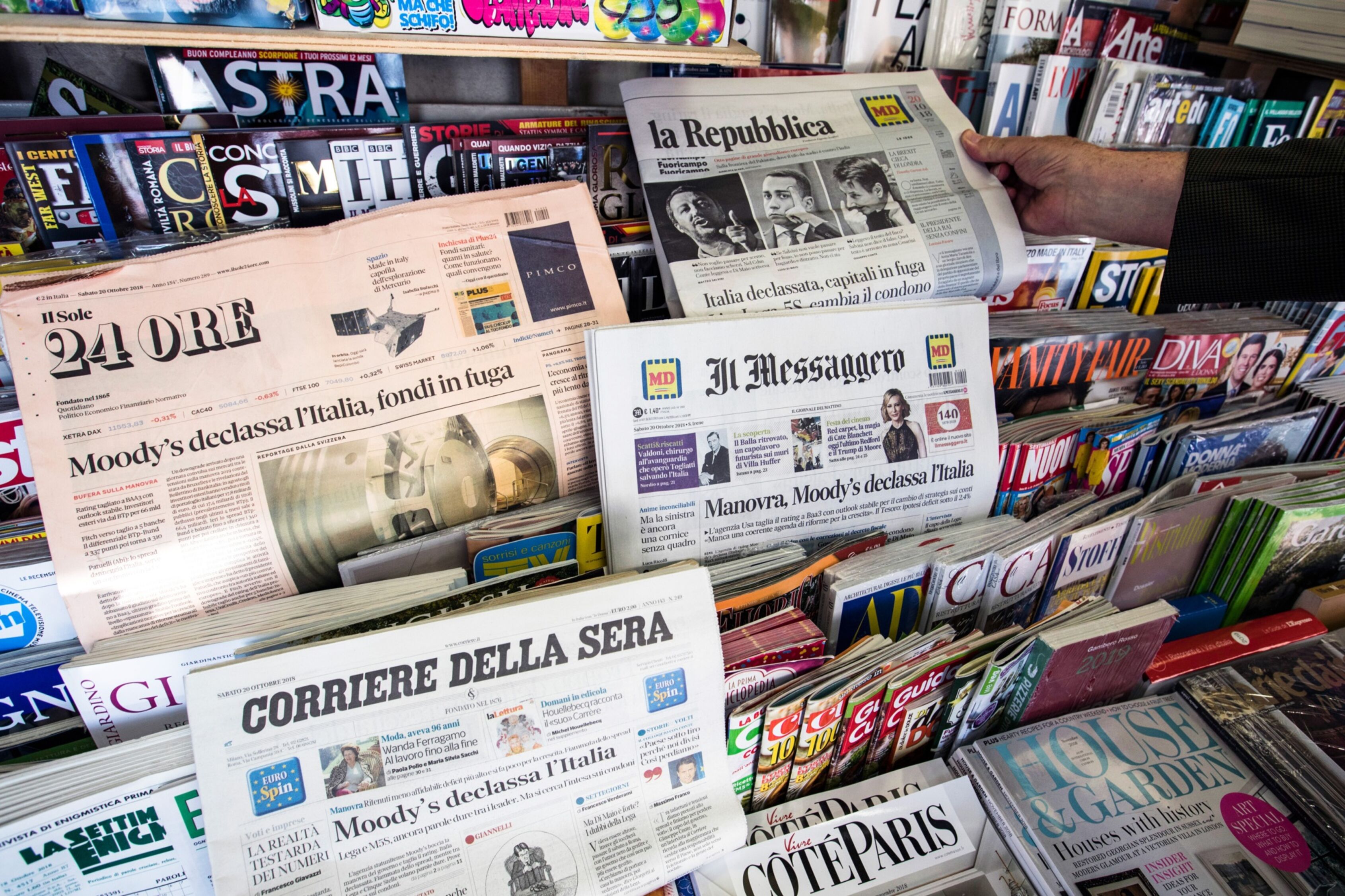Italian newspapers in 2018 with front page stories about Moody&rsquo;s rating on Italy are displayed on sale in a newsstand in Rome, Italy.